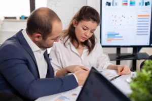 colleagues-startup-business-discussing-looking-documents-company-board-brainstorming-conference-room-checking-graphs-charts - BVOPro - BVOPro